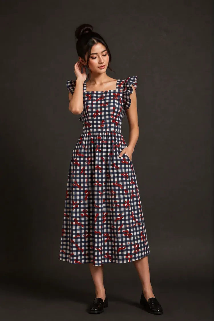 Model in a patterned midi dress